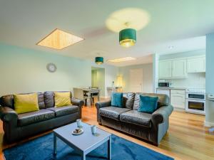 a living room with two couches and a table at 2 Bed in Sanquhar 89403 in Sanquhar