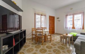 a living room with a couch and a table at Awesome Home In Torrevieja With Wifi in Torrevieja
