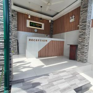 a reception area in a lobby with a reception desk at AOSMECPoolCamp Hotel in Lapu Lapu City +55 photos