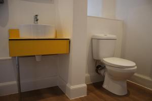 a bathroom with a toilet and a sink at Safestay Edinburgh Cowgate in Edinburgh