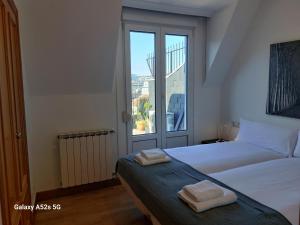 A bed or beds in a room at Centenario