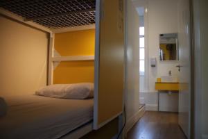 a bedroom with a bunk bed and a sink at Safestay Edinburgh Cowgate in Edinburgh