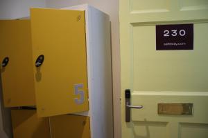 a yellow door with a speed sign on it at Safestay Edinburgh Cowgate in Edinburgh