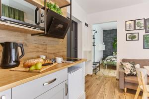 Kuchyň nebo kuchyňský kout v ubytování Apartamenty Śniadanie do Łóżka