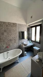 a bathroom with two sinks and a tub and two sinks at Begur, mon amour in Begur +27 photos