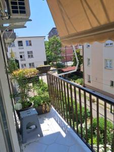 an apartment balcony with a view of a courtyard at Avocado Apartment in Ohrid