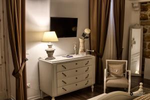 TV a/nebo společenská místnost v ubytování TAM Vacanze B&B