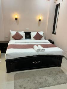 Ένα ή περισσότερα κρεβάτια σε δωμάτιο στο Bia Hotel
