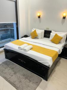 Ένα ή περισσότερα κρεβάτια σε δωμάτιο στο Bia Hotel