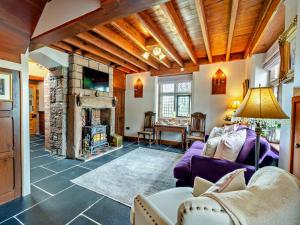 a living room with a couch and a fireplace at 1 Bed in Barrow-in-Furness 91590 in Barrow in Furness