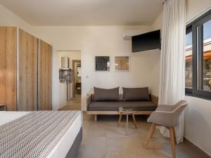 TV a/nebo společenská místnost v ubytování Casa D'Irene Deluxe Hotel