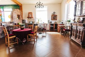 a dining room with a table and chairs at D.W.KaMil in Łeba