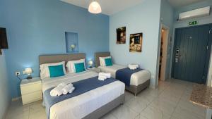 Postel nebo postele na pokoji v ubytování Myrto Hotel