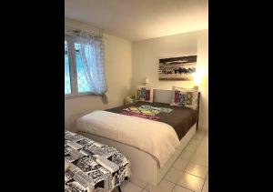 a bedroom with two beds and a window at Grabels Soleil Calme & Piscine in Grabels +11 photos