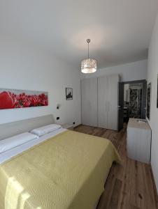 Ένα ή περισσότερα κρεβάτια σε δωμάτιο στο Maison Maurizio Marconi