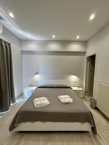 a bedroom with a bed with two towels on it at B&b Al Centro Nicosia in Nicosia +10 photos