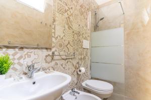 Koupelna v ubytování Hotel Lariana