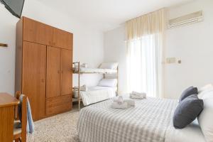 Postel nebo postele na pokoji v ubytování Hotel Lariana
