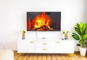 a living room with a fire in the fireplace at Unity Haven Tatu City in Tatu City