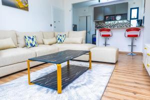 a living room with a couch and a table at Unity Haven Tatu City in Tatu City