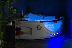 a white bath tub in a blue room at Aurelia Garden Suite in Rome +43 photos