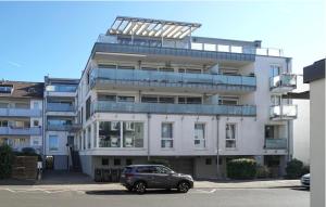 a car parked in a parking lot in front of a building at guestified MILO NOEL Hotel in Bonn