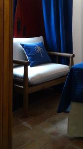 a bench with a blue pillow on top of it at Casa do Limoeiro - sleeps up to 4 comfortably in Serpa +37 photos