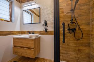 a bathroom with a sink and a shower at Dom na Górce in Groń +36 photos