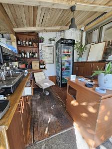 a kitchen with a counter and a refrigerator at Traveler Hostel 2 in Shkodër