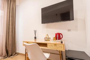 Μια τηλεόραση ή/και κέντρο ψυχαγωγίας στο Armonica Rooms +16 φωτογραφίες