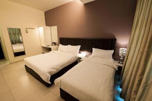 Postel nebo postele na pokoji v ubytování Seven Hotel