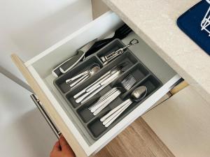 a drawer in a counter with utensils in it at ApartHotel Villa Eva 1 bedroom in Olympiaki Akti