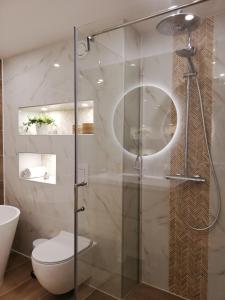 Koupelna v ubytování Cozy Nest + 9 fotografií