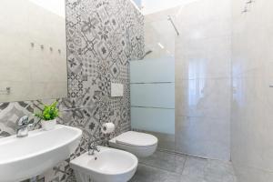 Koupelna v ubytování Hotel Lariana