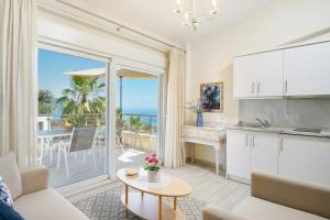 a kitchen and living room with a view of the ocean at INROY SEA VIEW APARTMENTS in Skala Potamias