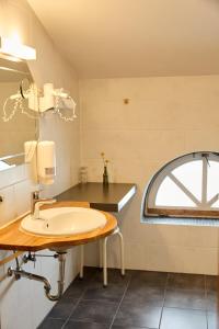 a bathroom with a sink and a window at Hotel Luitpold am See in Prien am Chiemsee +54 photos