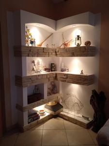 a room with wooden shelves on the wall at Apartman Andrija Polje in Polje