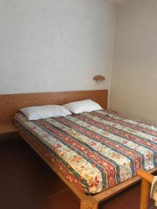 Postel nebo postele na pokoji v ubytování Appartamento vista mare Residence Cugnana Verde