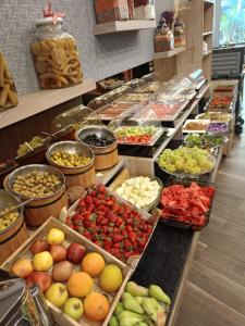 a buffet filled with lots of different fruits and vegetables at Ber Mai İnci Hotel Antalya in Antalya