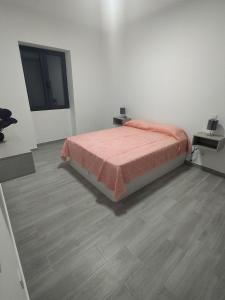 a bedroom with a bed and a wooden floor at Vila Ramos I in Funchal