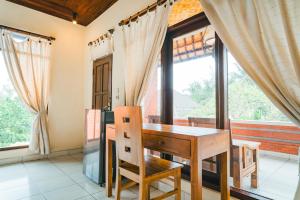 Balkón nebo terasa v ubytování Bismajaya Bungalow