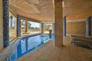 a large swimming pool in a house at Apartamentos Azul Playa in Cala d´Or