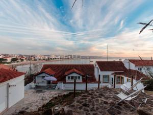 a house with a view of the water at Casa Azul do Cais in São Martinho do Porto