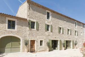 an external view of a large stone building at Mas de l'Etoile in Aureille