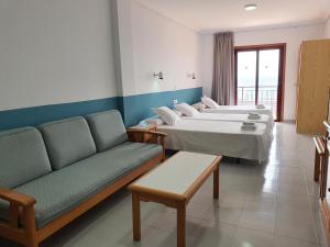 Postel nebo postele na pokoji v ubytování Hotel Castillete