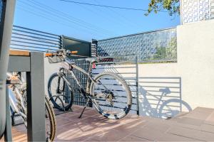 a bike is chained to a fence on a balcony at La Casa Marina Suites & Rooms in Fethiye