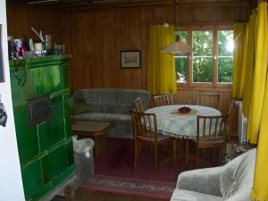 a living room with a table and a couch at Haus am Ufer in Gaienhofen