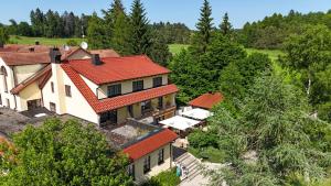 an overhead view of a house with a red roof at Hotel Gasthof Süßer Grund in Albstadt