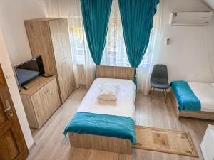 Postel nebo postele na pokoji v ubytování Hotel-Restaurant Milenium + 37 fotografií