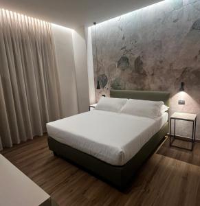 Postel nebo postele na pokoji v ubytování Hotel La Rocca + 37 fotografií